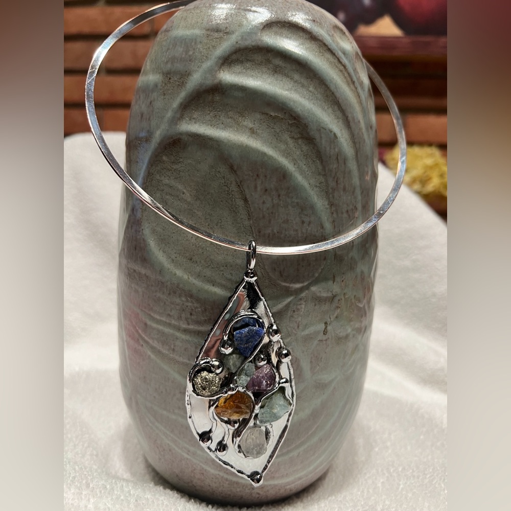 Multi stone silver toned pendant